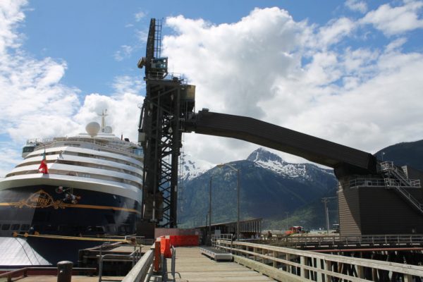 The Disney Wonder cruise ship docks near the ship loader at Skagway’s ore terminal. (Photo by Henry Leasia, KHNS - Haines)