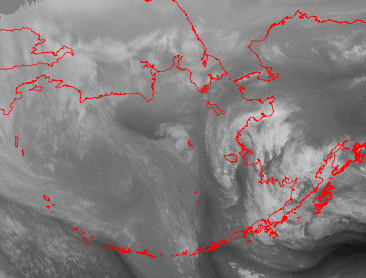 A satelite image with the red outline of Alaska. 