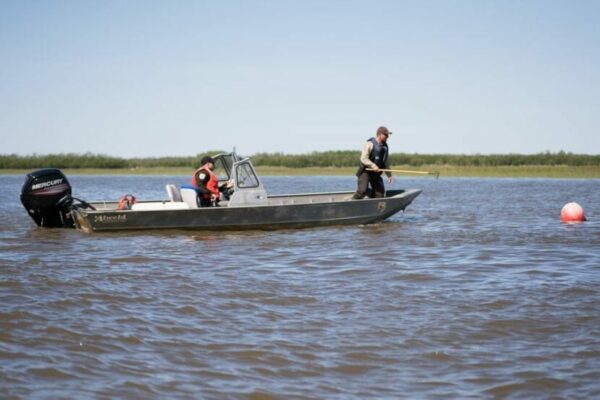 A boat with two people in it