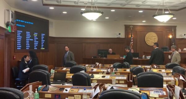 A house floor with a bunch of people wandering around