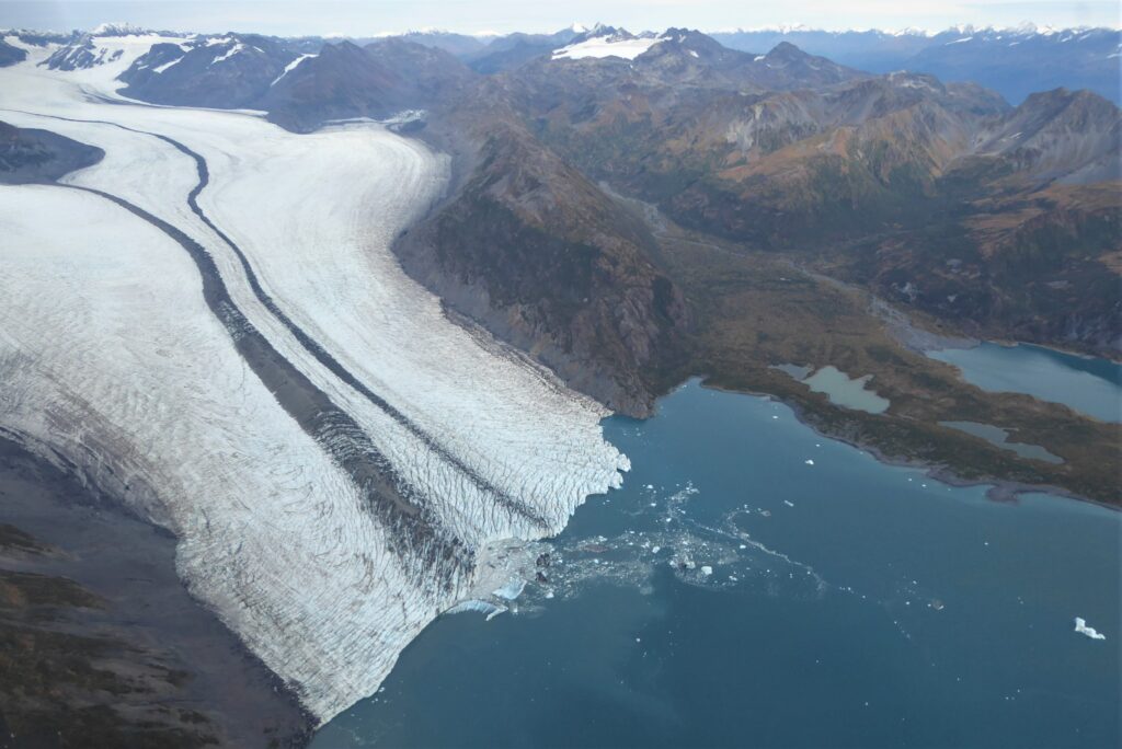 A glacier with a lagoon near it